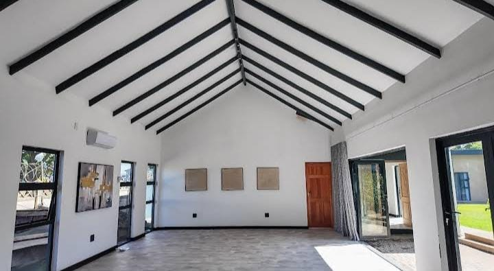 Spacious conference hall with exposed beams