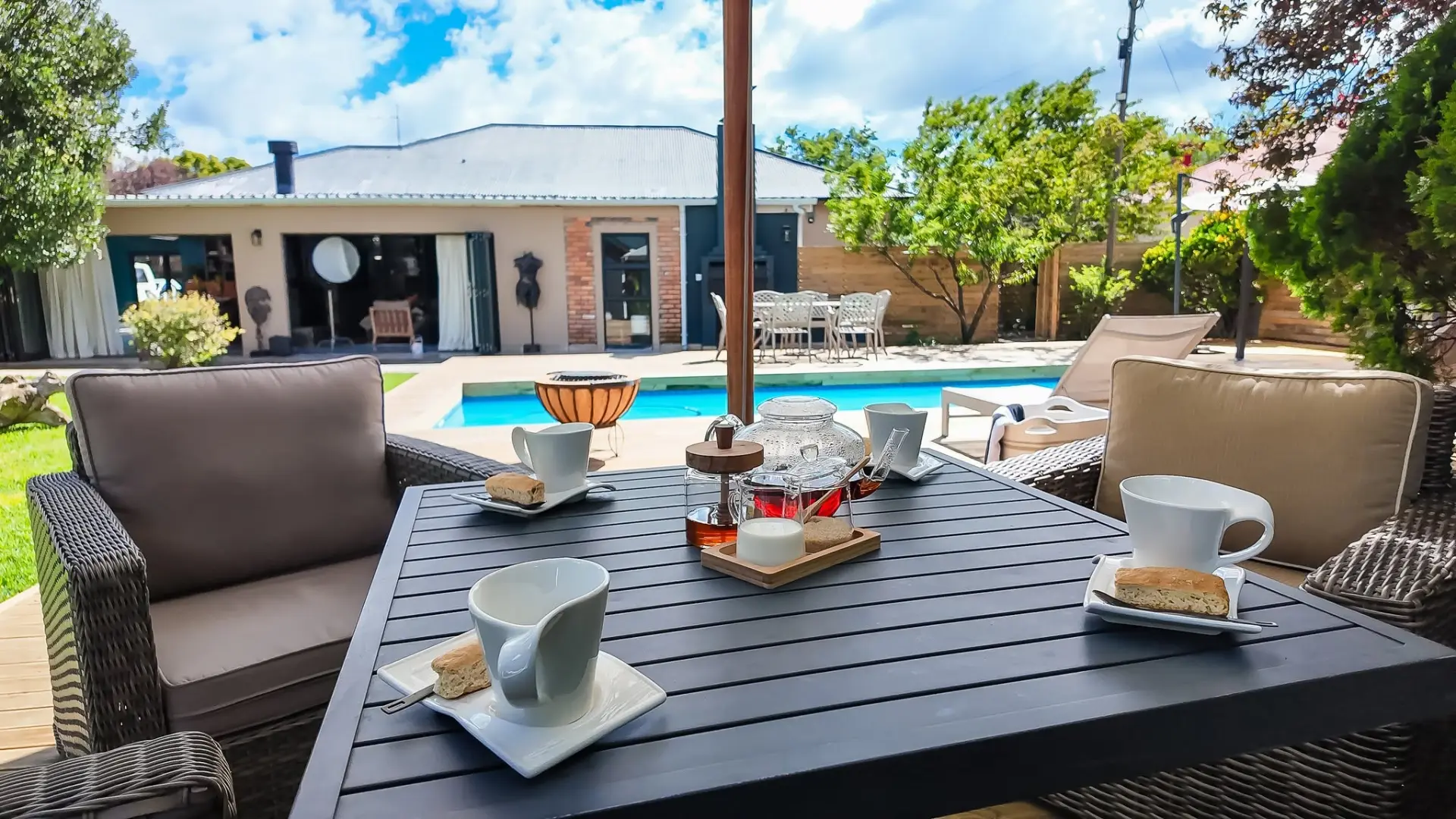 Tea and biscuits served on the patio overlooking the pool